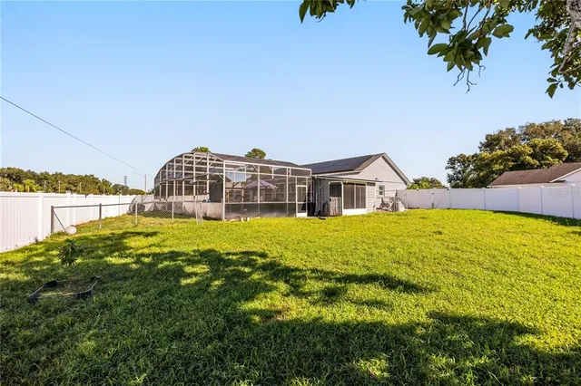 a house view with swimming pool in front of it