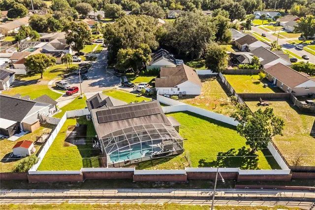 an aerial view of residential houses with swimming pool