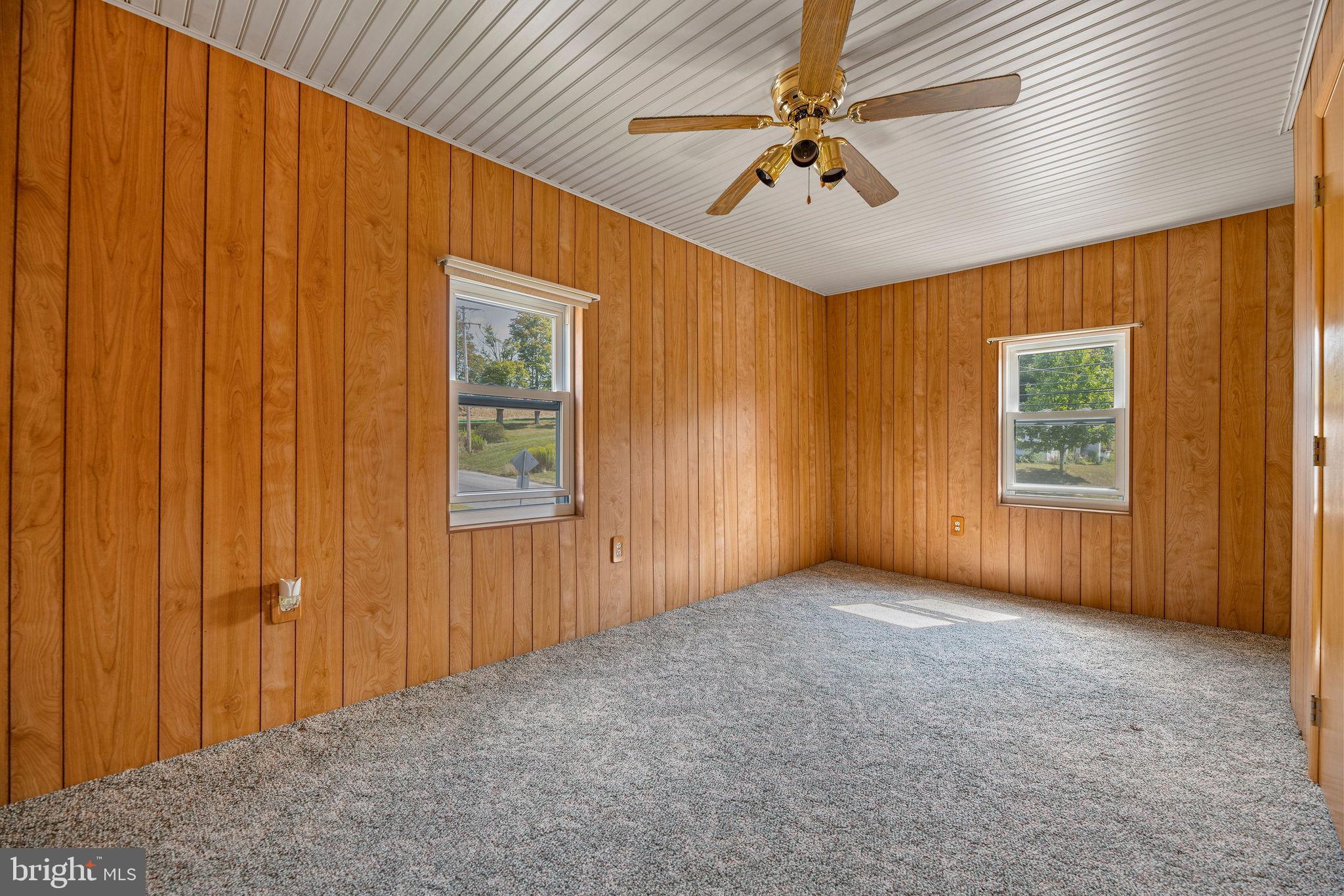 113 Loch Lomond Road Philipsburg, PA 16866 - Photo 30 of 33 an empty room with windows and fan