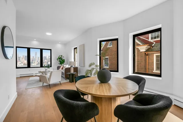 a bathroom with a white bath tub a toilet and a sink