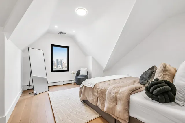 a bedroom with bed and a window