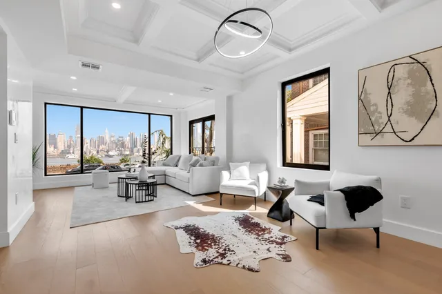 a living room with furniture or couch and a large window