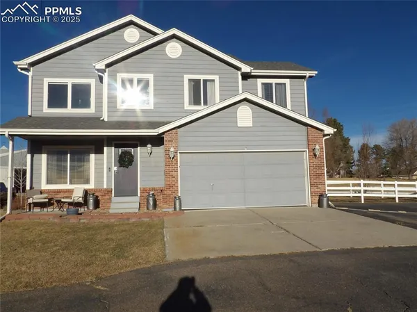a front view of a house with a outdoor space