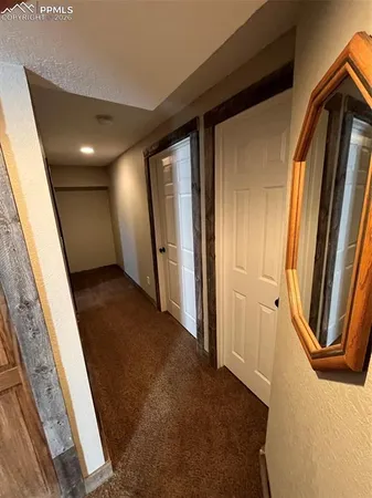 a view of hallway with windows