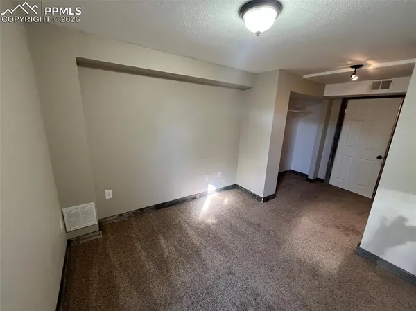 a view of a room with an empty space