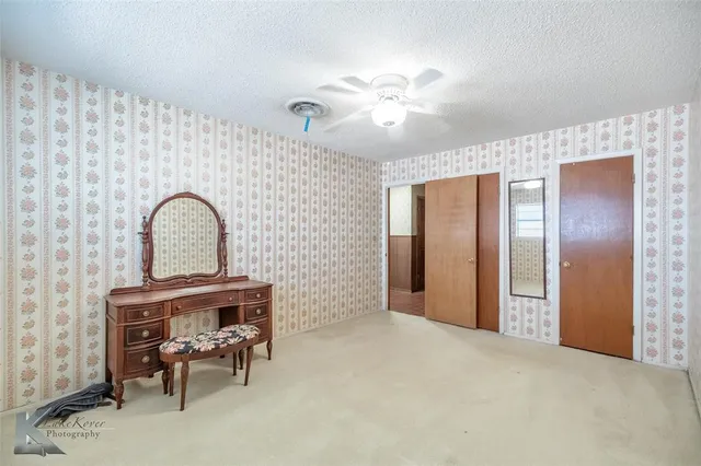 a view of a livingroom with furniture and chandelier
