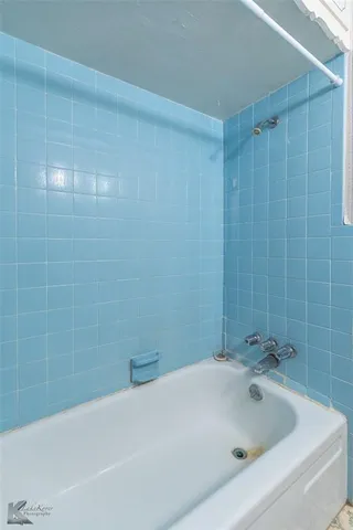 a bathroom with a bathtub