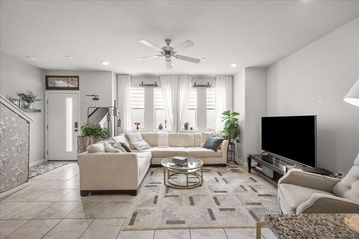 9015 Cattle Baron Path, Unit 1203 Austin, TX 78747 - Photo 10 of 23 Living room with ceiling fan and recessed lighting