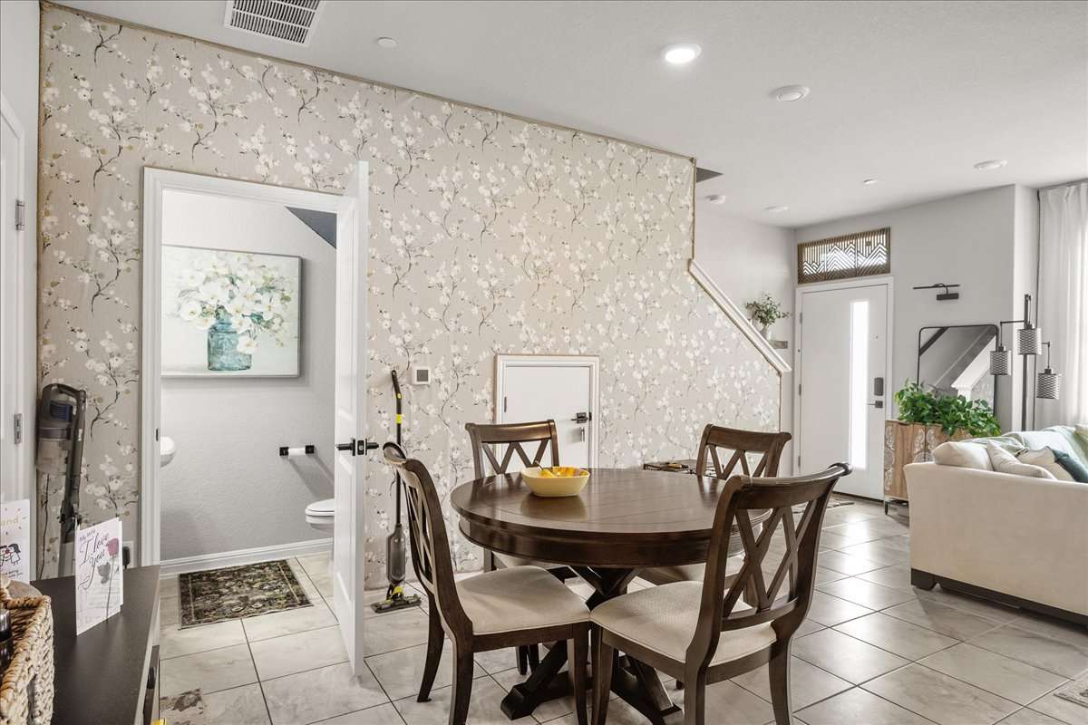 9015 Cattle Baron Path, Unit 1203 Austin, TX 78747 - Photo 7 of 23 Dining area with recessed lighting and light tile patterned flooring