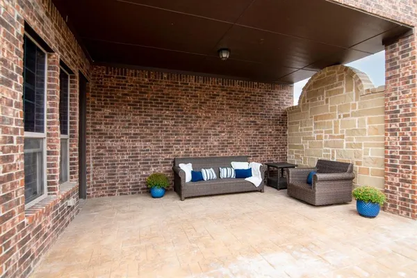 a view of outdoor seating area with blue umbrella
