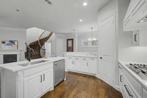 a kitchen with a sink stove and refrigerator