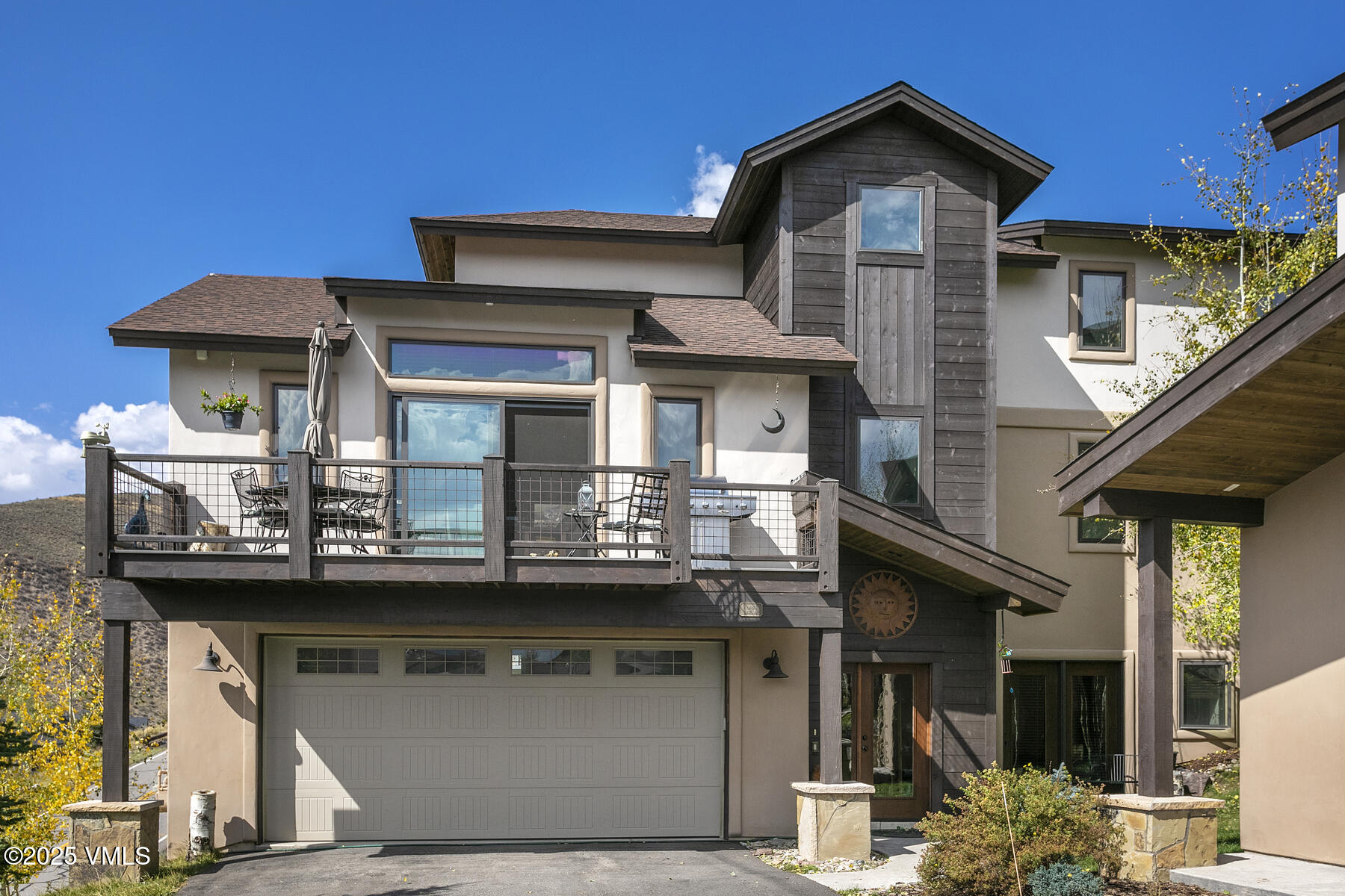a front view of a house with glass windows