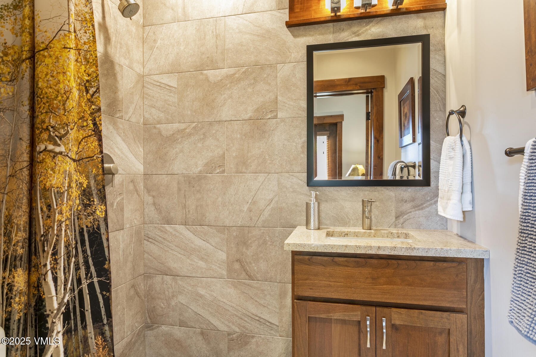1015 West Wildwood Road, Unit H Avon, CO 81620 - Photo 14 of 38 a bathroom with a sink and a mirror