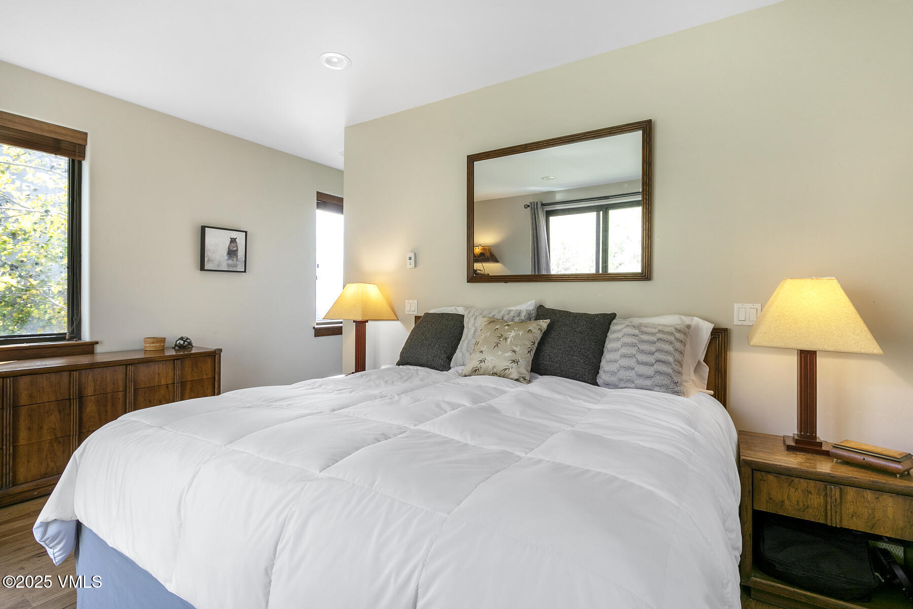 1015 West Wildwood Road, Unit H Avon, CO 81620 - Photo 16 of 38 a bedroom with a bed and a lamp