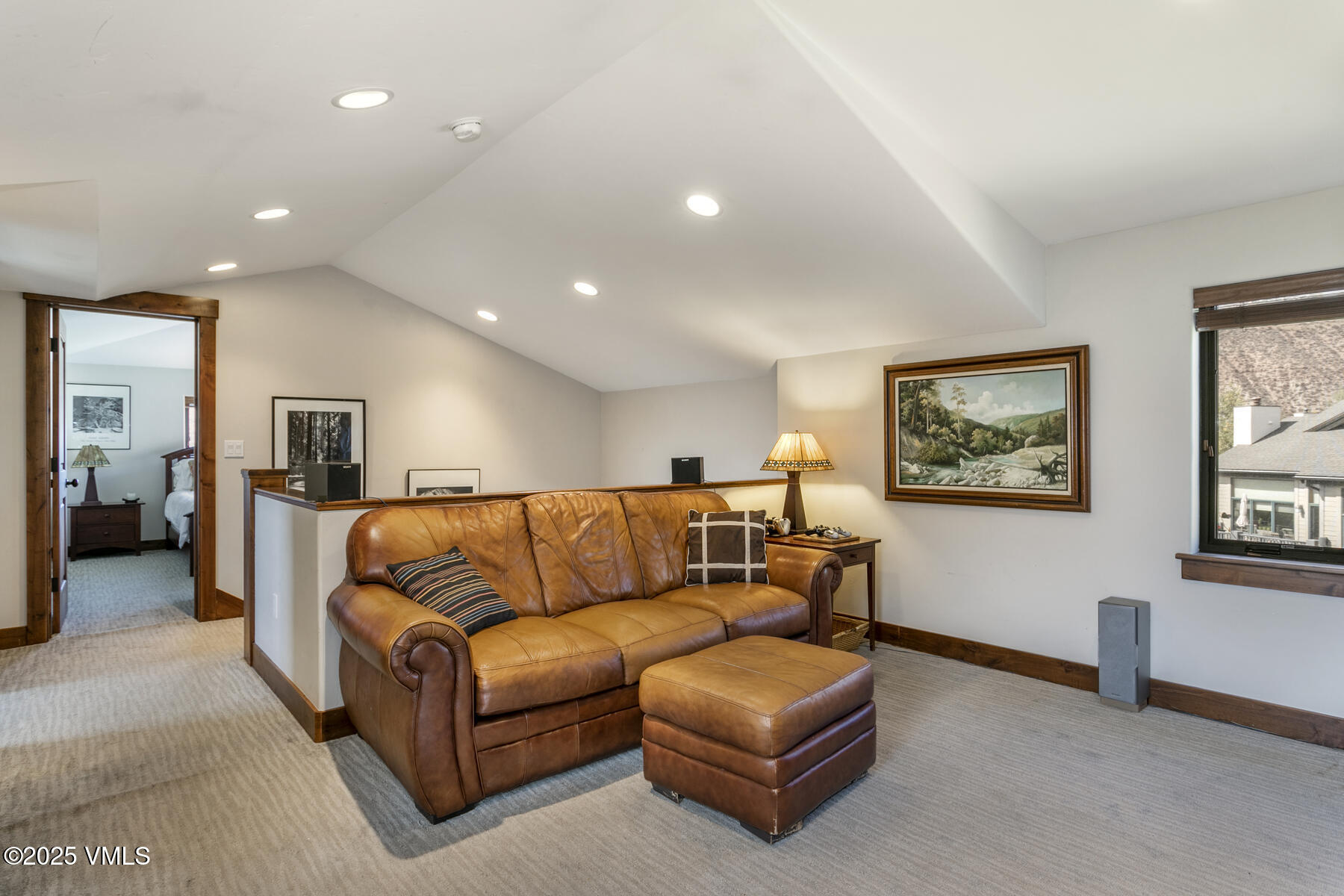 1015 West Wildwood Road, Unit H Avon, CO 81620 - Photo 21 of 38 a living room with furniture and a flat screen tv