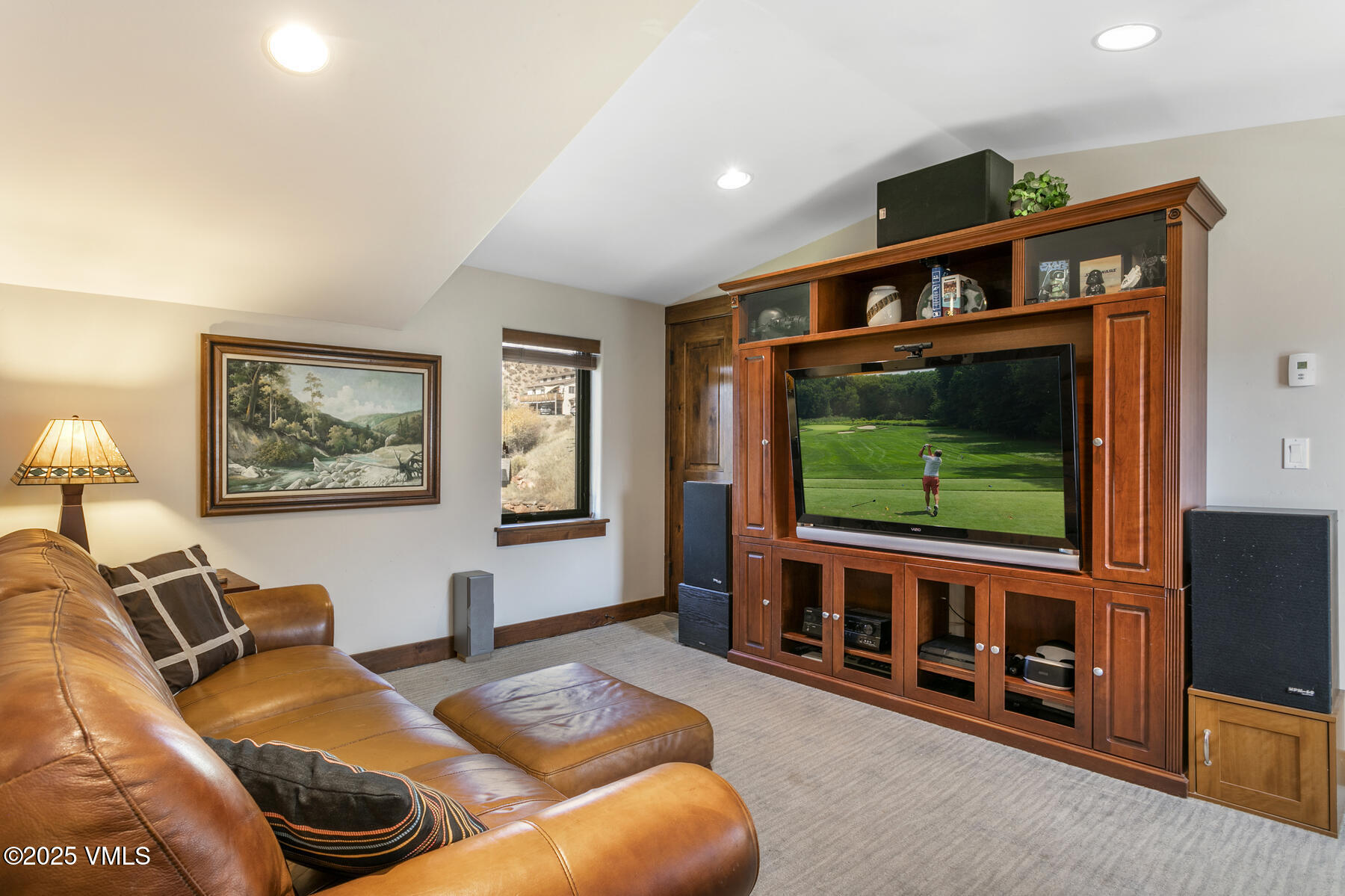 1015 West Wildwood Road, Unit H Avon, CO 81620 - Photo 22 of 38 a bedroom with furniture and a flat screen tv