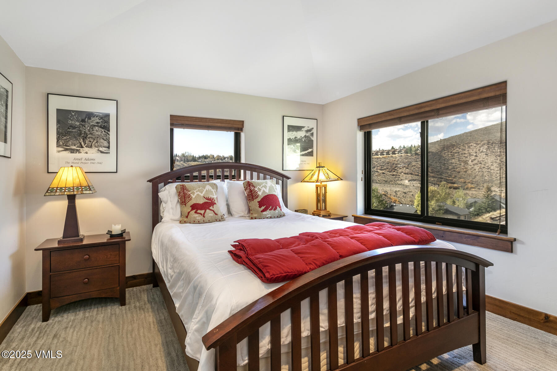 1015 West Wildwood Road, Unit H Avon, CO 81620 - Photo 23 of 38 a bedroom with a bed and wooden floor