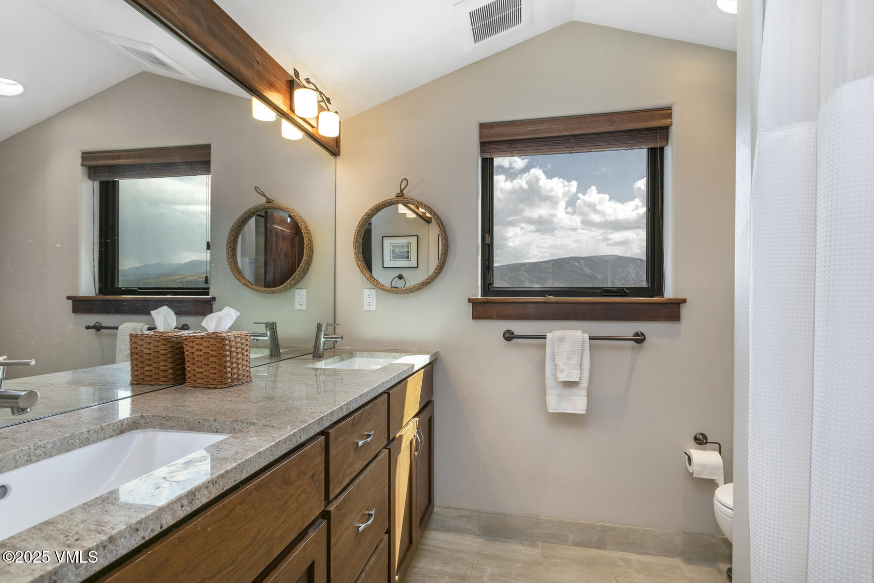 1015 West Wildwood Road, Unit H Avon, CO 81620 - Photo 24 of 38 a bathroom with a sink and a mirror