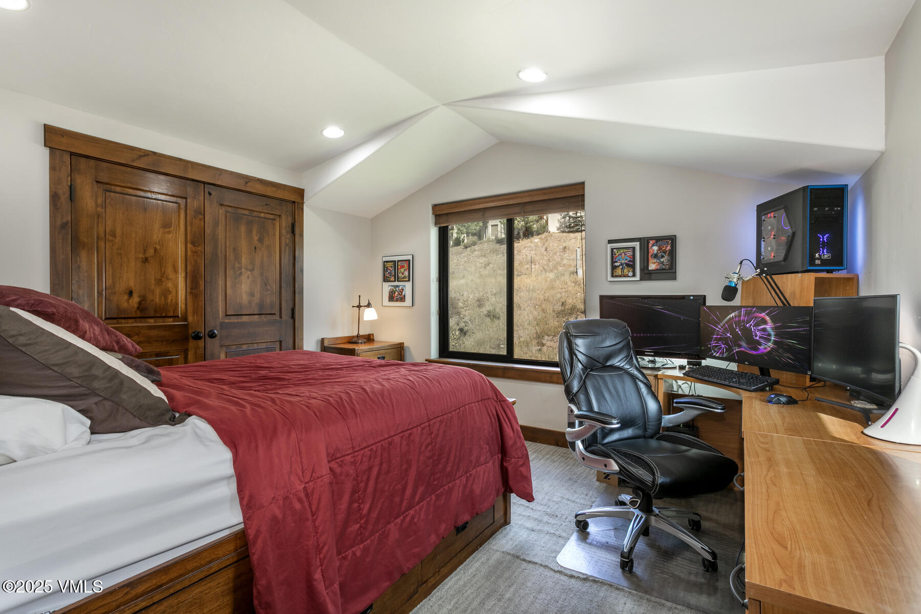 1015 West Wildwood Road, Unit H Avon, CO 81620 - Photo 26 of 38 a bedroom with a bed a computer on the desk and a dresser next to a window