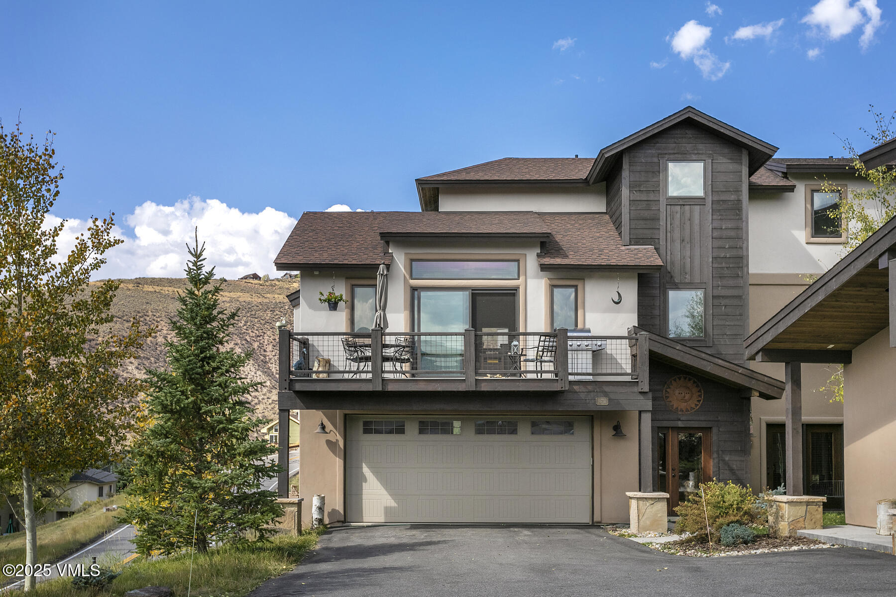 1015 West Wildwood Road, Unit H Avon, CO 81620 - Photo 29 of 38 a front view of a house with a yard