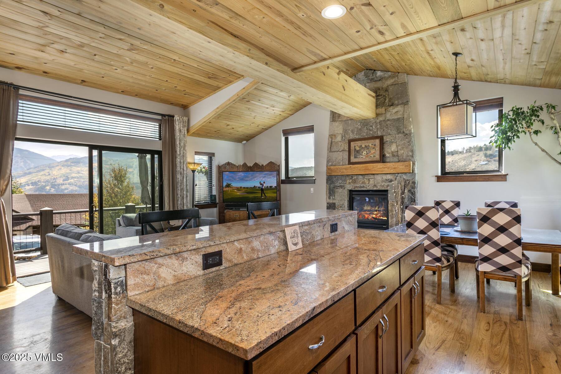 1015 West Wildwood Road, Unit H Avon, CO 81620 - Photo 3 of 38 a view of a dining room with furniture window and wooden floor