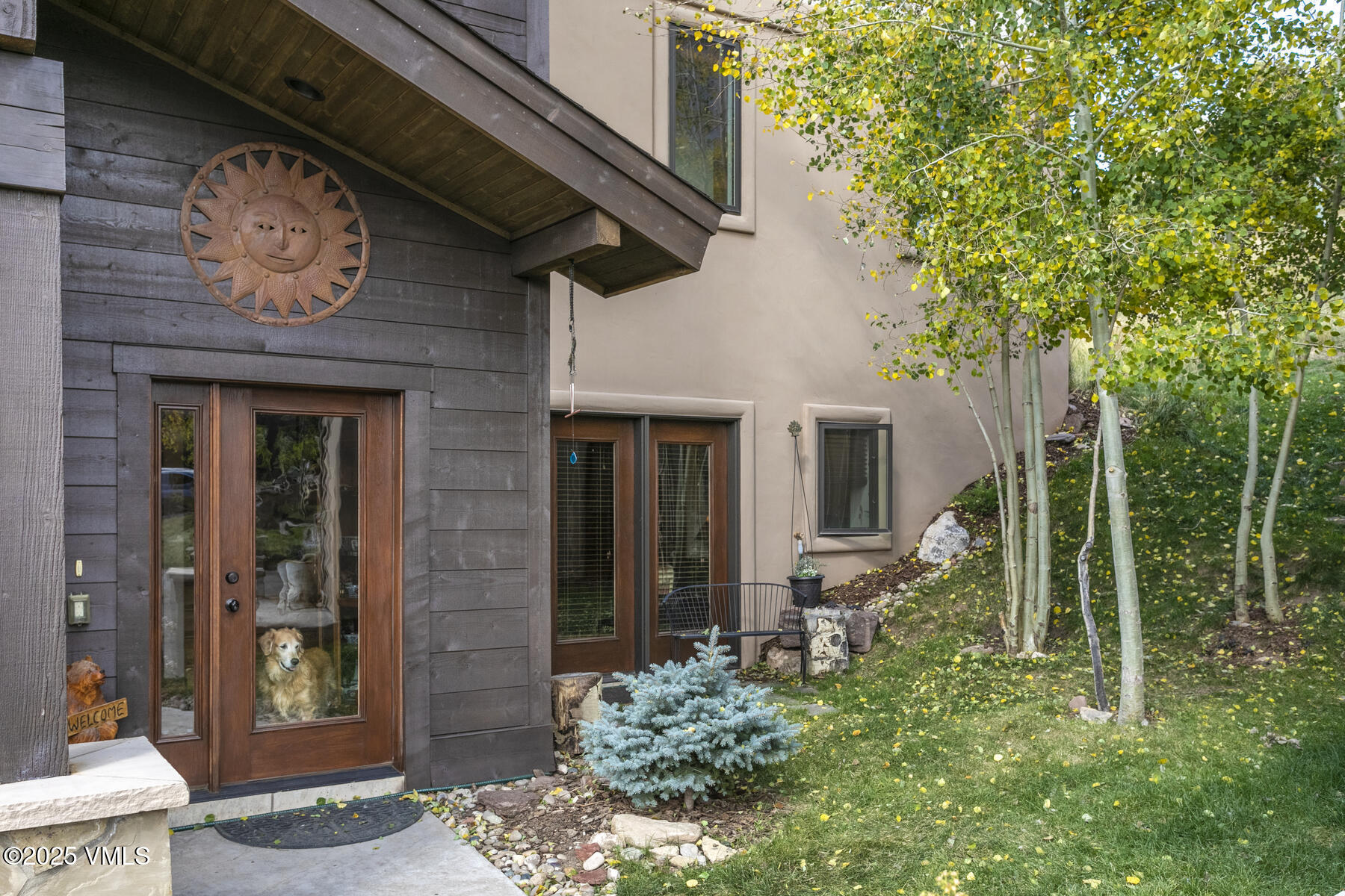 1015 West Wildwood Road, Unit H Avon, CO 81620 - Photo 31 of 38 a view of a house with a clock on the wall