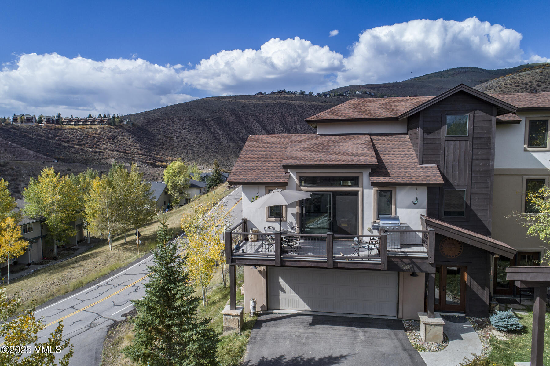 1015 West Wildwood Road, Unit H Avon, CO 81620 - Photo 37 of 38 a aerial view of a house with swimming pool table and chairs