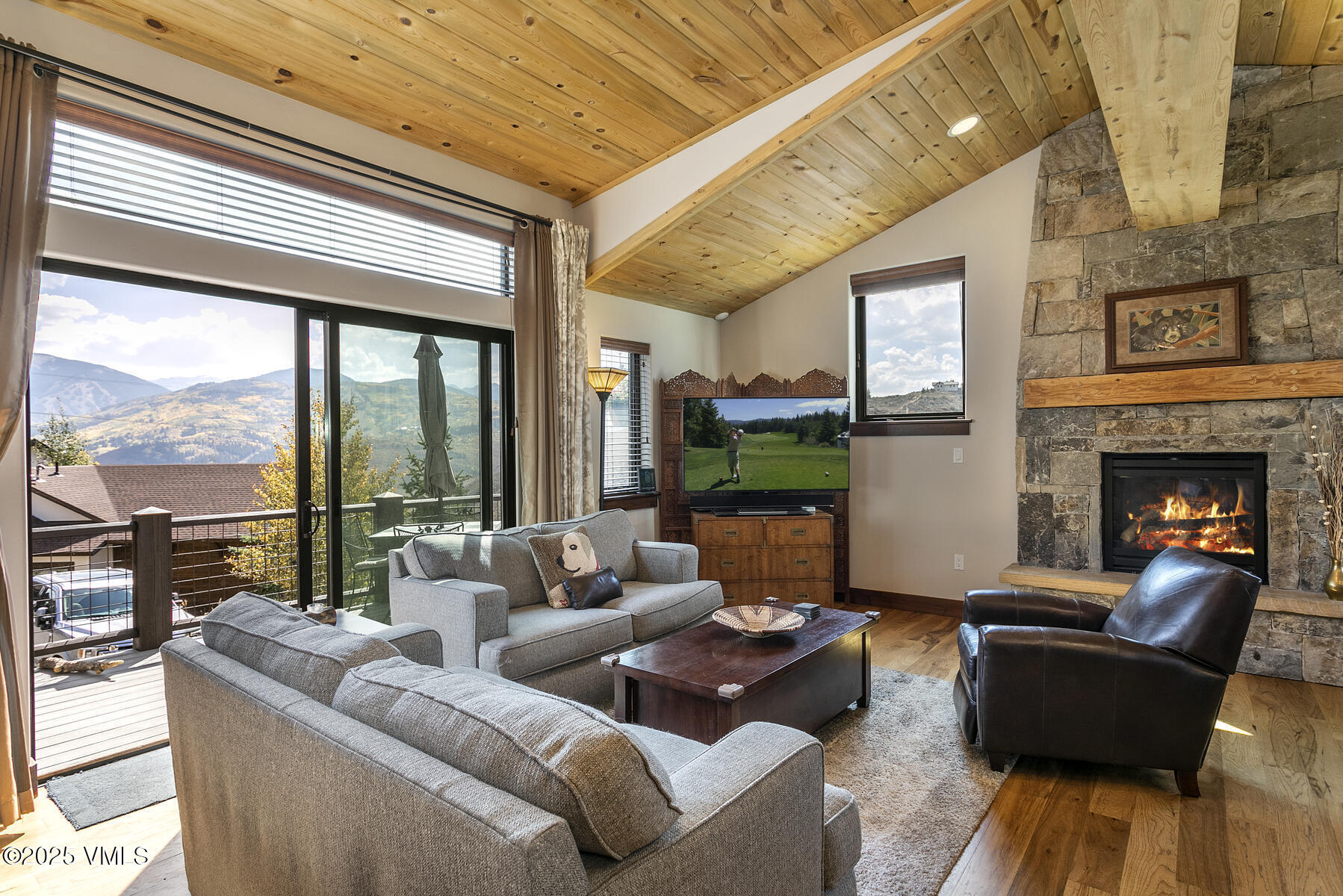 1015 West Wildwood Road, Unit H Avon, CO 81620 - Photo 5 of 38 a living room with furniture and a fireplace