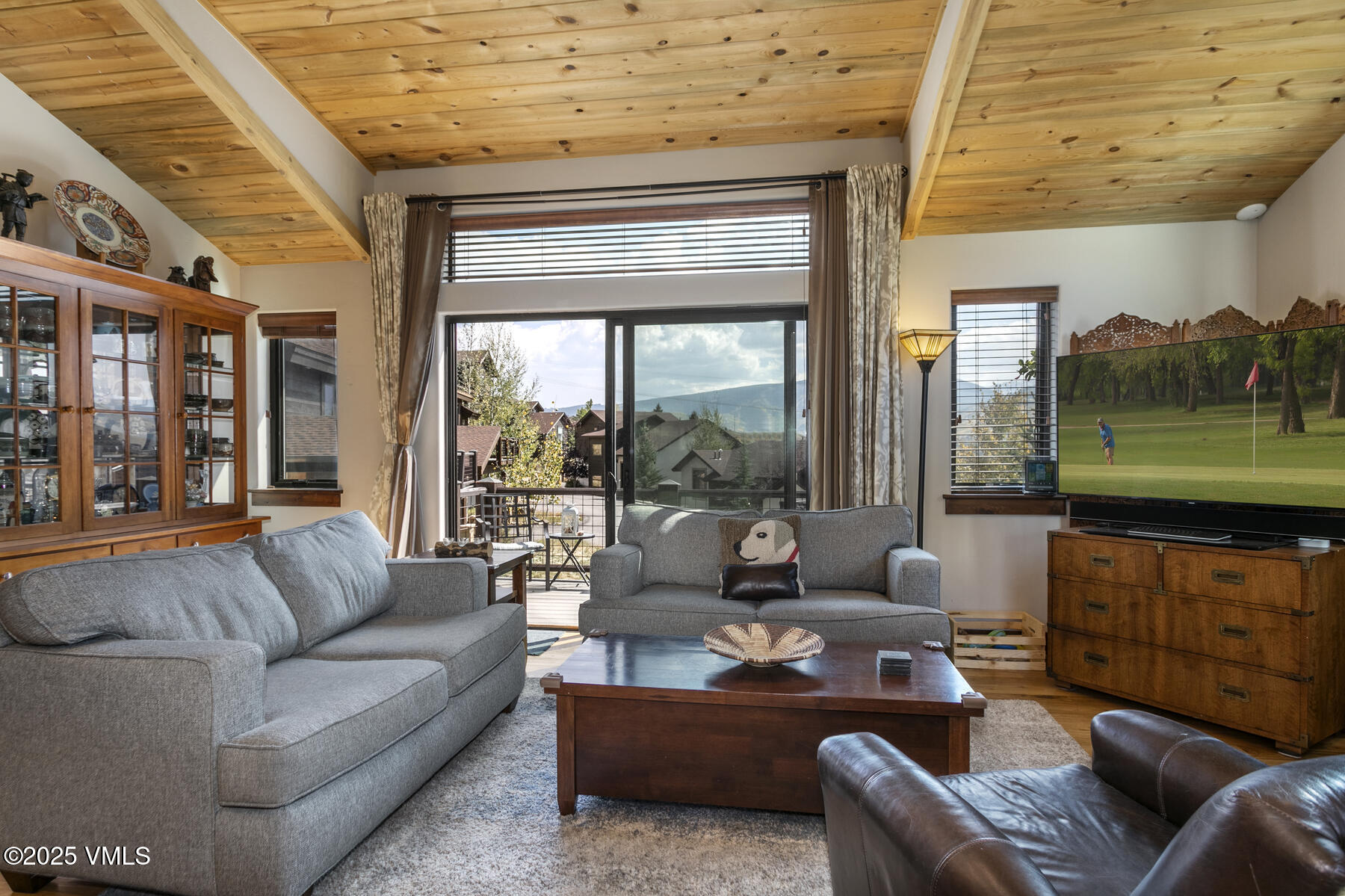 1015 West Wildwood Road, Unit H Avon, CO 81620 - Photo 7 of 38 a living room with furniture and a large window