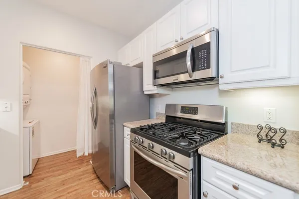 a kitchen with a stove and a microwave