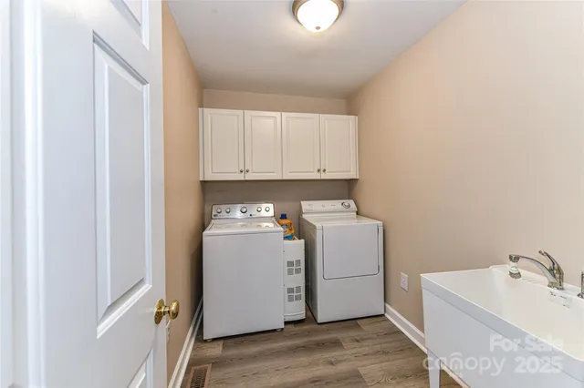 a balcony with wooden floor and fence