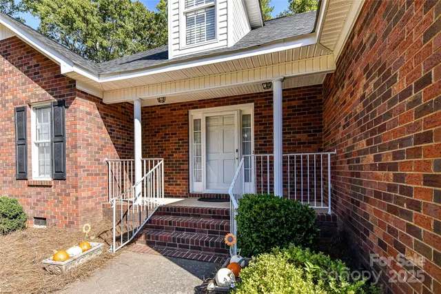 a view of a room with window and a ceiling fan