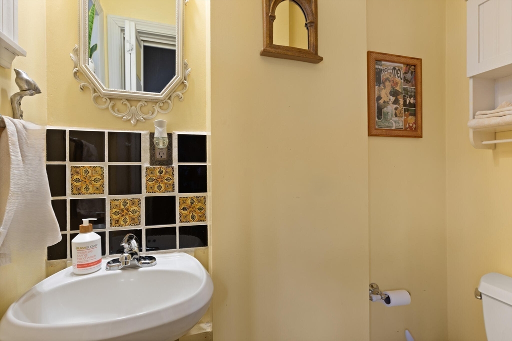 29 Station Street Sharon, MA 02067 - Photo 23 of 42 a bathroom with a sink and a mirror