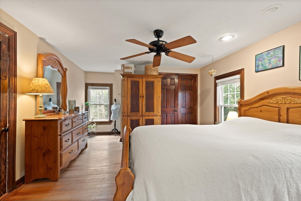 29 Station Street Sharon, MA 02067 - Photo 24 of 42 a bedroom with a bed and wooden floor