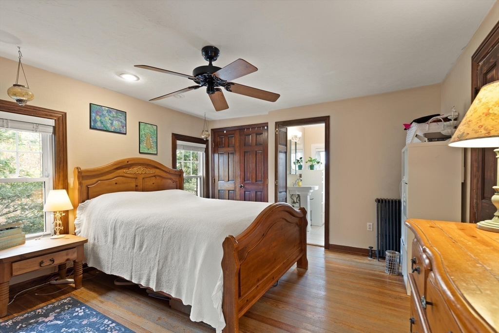 29 Station Street Sharon, MA 02067 - Photo 25 of 42 a bedroom with a bed and wooden floor