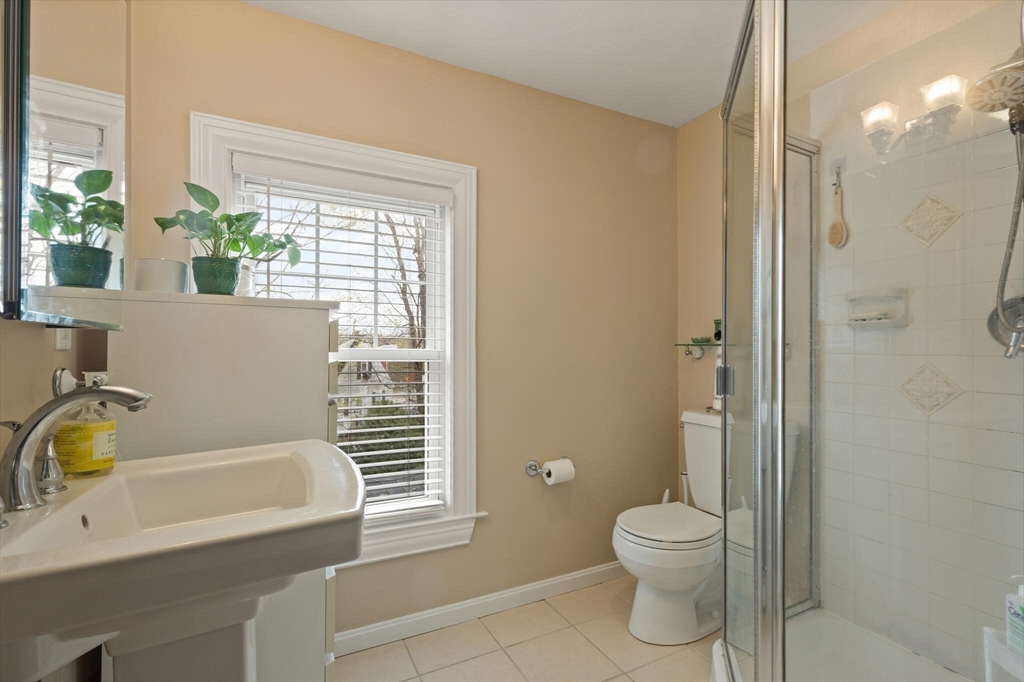 29 Station Street Sharon, MA 02067 - Photo 26 of 42 a bathroom with a sink a toilet and shower