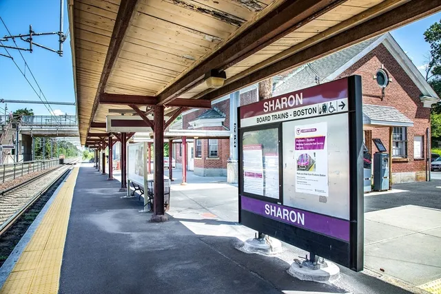 a front view of building with yard swimming pool and outdoor seating