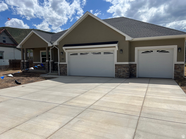 160 200 West Henefer, UT 84033 - Photo 2 of 25 Contemporary stucco exterior with a stone veneer accent