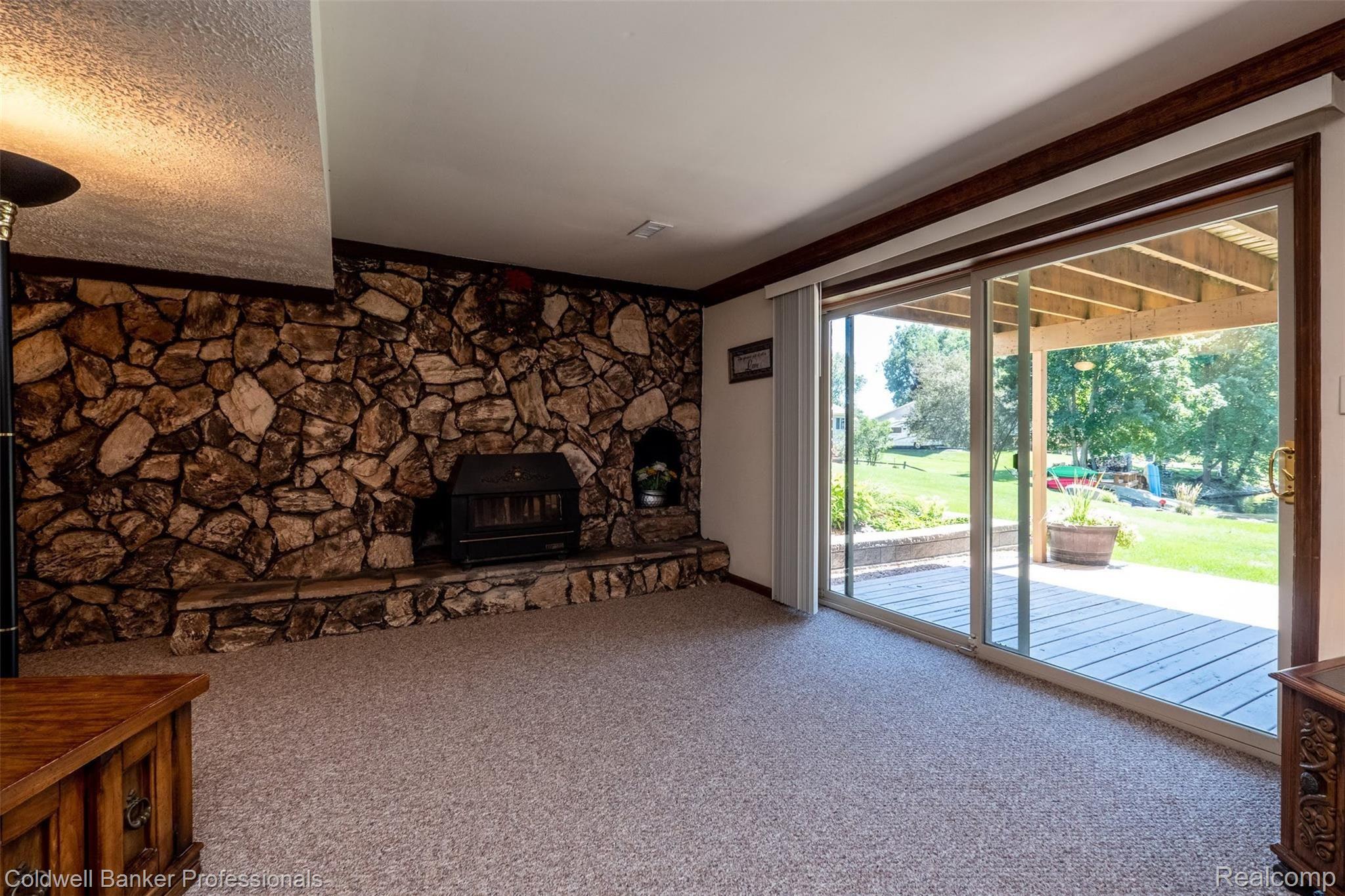 2745 Ripple Way White Lake, MI 48383 - Photo 47 of 58 BEAUTIFUL VIEW OF DECK AND NEW LANDSCAPING