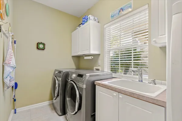 a utility room with dryer and washer