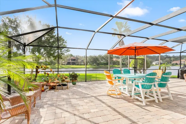 a view of swimming pool with a lounge chairs