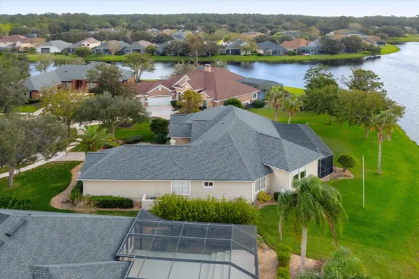 an aerial view of a house with a lake view