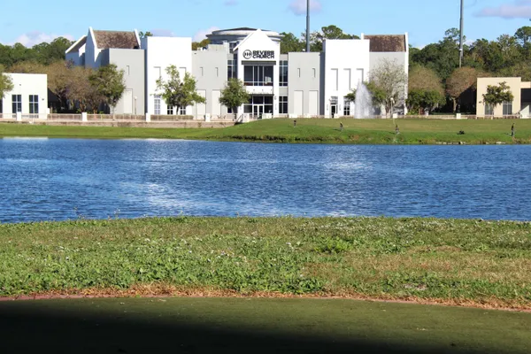 a view of a house with a yard and sitting area