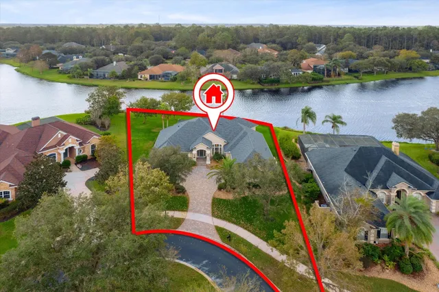 an aerial view of lake and residential houses
