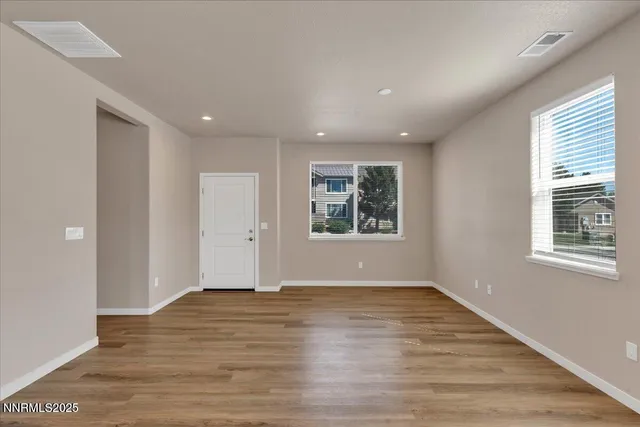a view of hallway with a bathroom and a sink