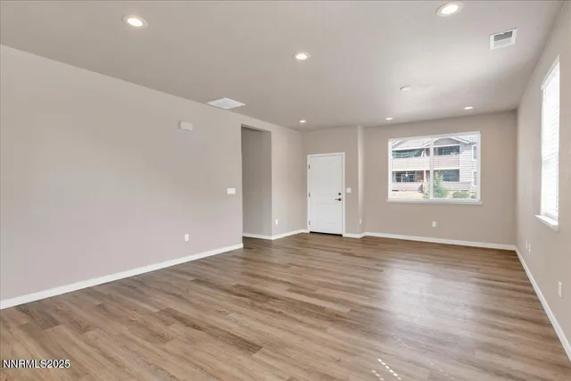 a view of kitchen with wooden floor and window