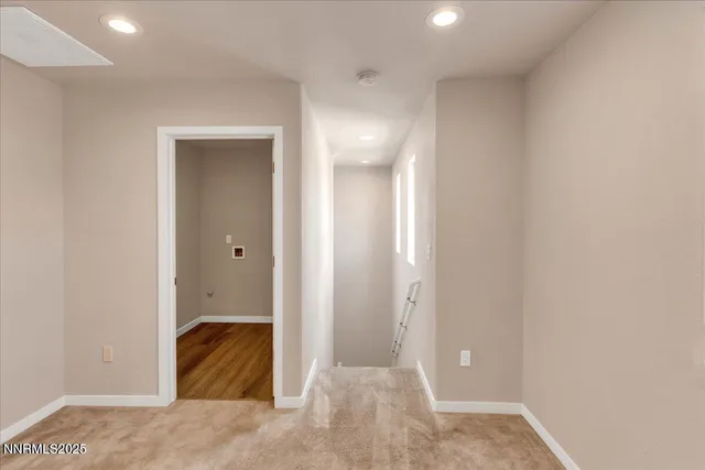 a view of a small space with wooden floor