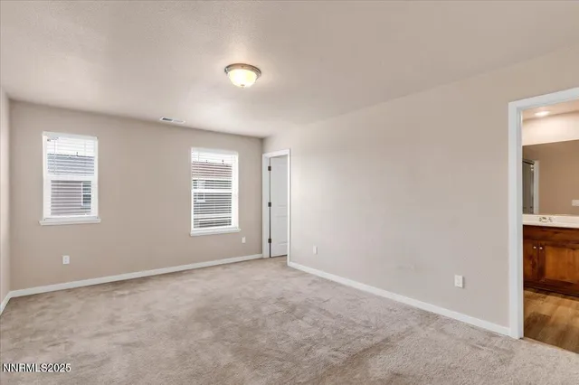 a bathroom with a granite countertop sink mirror and shower