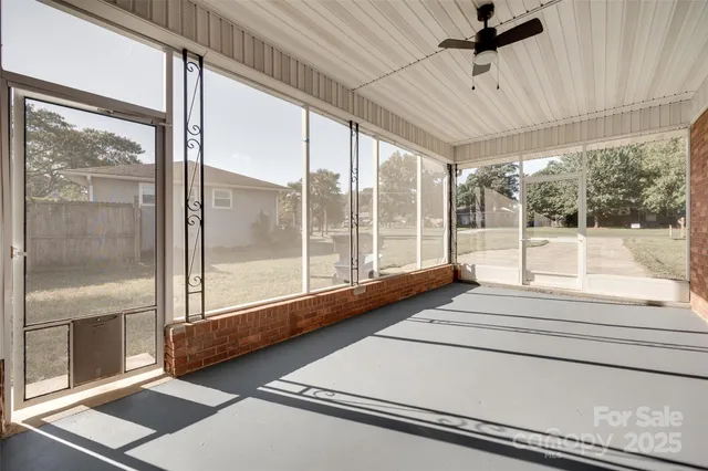 a view of a room with a large window