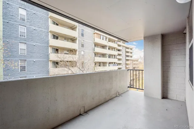 a view of a living room with a large window